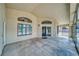 Spacious covered patio featuring large windows and sliding glass doors offering abundant natural light at 151 Hornet St, Pahrump, NV 89048