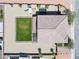 Overhead view of backyard featuring a well-maintained lawn, playground equipment, gravel, and tile roof at 1512 Sagefield Way, Logandale, NV 89021