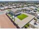 Expansive backyard with desert landscaping, green lawn and large patio at 1512 Sagefield Way, Logandale, NV 89021