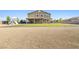 Expansive backyard featuring lush grass, playground equipment, and gravel, perfect for outdoor activities at 1512 Sagefield Way, Logandale, NV 89021