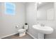 Powder room featuring modern fixtures and a pedestal sink at 1512 Sagefield Way, Logandale, NV 89021