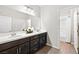 Bathroom with double sink vanity, wood flooring, and a separate shower and toilet area at 1512 Sagefield Way, Logandale, NV 89021