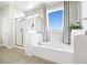 Bright bathroom with a soaking tub, separate shower, and modern finishes at 1512 Sagefield Way, Logandale, NV 89021