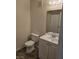 Simple bathroom with a single sink vanity, toilet, and a mirrored medicine cabinet at 3953 Rebecca Raiter Ave # 202, Las Vegas, NV 89110