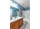 Bright bathroom with modern fixtures, blue walls and a shower/tub combo at 41 Stablewood Ct, North Las Vegas, NV 89084