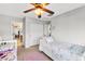 Bedroom featuring neutral-toned walls, carpeted floors, and a ceiling fan at 41 Stablewood Ct, North Las Vegas, NV 89084