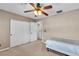 Bedroom boasts a ceiling fan, closet, and comfortable bed at 41 Stablewood Ct, North Las Vegas, NV 89084