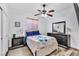 Cozy bedroom with a ceiling fan, dresser, nightstand and soft lighting at 41 Stablewood Ct, North Las Vegas, NV 89084
