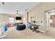 Bright bonus room featuring neutral tones, a ceiling fan, and a cozy beanbag chair at 41 Stablewood Ct, North Las Vegas, NV 89084