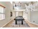 Spacious game room with a pool table, two-story ceiling and natural light at 41 Stablewood Ct, North Las Vegas, NV 89084