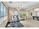 Large at home gym area featuring multiple machines, natural light and an airy feel at 41 Stablewood Ct, North Las Vegas, NV 89084