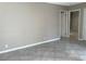 Well lit bedroom with tile flooring, neutral paint, and an open door frame at 461 N Lamb Blvd # H, Las Vegas, NV 89110