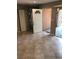 Open entryway showcasing neutral tile flooring and a view of the front door at 461 N Lamb Blvd # H, Las Vegas, NV 89110