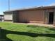 Exterior shot of home with well-maintained lawn and patio with direct access from inside at 461 N Lamb Blvd # H, Las Vegas, NV 89110