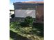 A neatly kept yard with a small, enclosed patio and lush lawn surrounding the home at 461 N Lamb Blvd # H, Las Vegas, NV 89110
