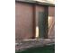 Exterior view of the property with a secured utility access door at 461 N Lamb Blvd # H, Las Vegas, NV 89110