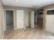 Bright living room with tile flooring, neutral walls, and multiple doorways, connecting to other rooms at 461 N Lamb Blvd # H, Las Vegas, NV 89110