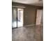 Bright living room with tile flooring, a sliding door to the outside and neutral walls at 461 N Lamb Blvd # H, Las Vegas, NV 89110