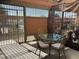 Cozy enclosed patio with seating and a view of the neighborhood, great for outdoor dining at 461 N Lamb Blvd # H, Las Vegas, NV 89110