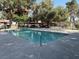 Community pool featuring clear blue water and a spacious concrete deck, perfect for summer relaxation at 461 N Lamb Blvd # H, Las Vegas, NV 89110