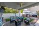Relaxing covered patio features cozy seating and an outdoor kitchen at 7800 Four Seasons Dr, Las Vegas, NV 89129