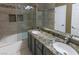 Beautiful bathroom with granite countertop, double sinks and shower over tub at 7800 Four Seasons Dr, Las Vegas, NV 89129
