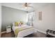 Comfortable bedroom with bright light, neutral colors, and a ceiling fan at 7800 Four Seasons Dr, Las Vegas, NV 89129