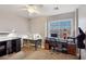 Bedroom with multiple desks, sewing machine, and large window at 7800 Four Seasons Dr, Las Vegas, NV 89129