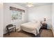 Cozy bedroom with bright window and accent chair at 7800 Four Seasons Dr, Las Vegas, NV 89129