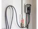 Close-up of an installed electric vehicle charging station on a garage wall at 7800 Four Seasons Dr, Las Vegas, NV 89129