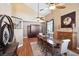 Elegant dining room with vaulted ceilings, a ceiling fan, a large dining table, and stylish decor at 7800 Four Seasons Dr, Las Vegas, NV 89129