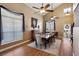 Elegant dining room featuring vaulted ceilings, large windows, a ceiling fan, and stylish decor at 7800 Four Seasons Dr, Las Vegas, NV 89129