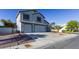 Two story home with two car garage, xeriscaping, and large driveway at 7800 Four Seasons Dr, Las Vegas, NV 89129