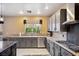 Well-equipped kitchen with granite countertops, stainless steel appliances, and ample cabinet space at 7800 Four Seasons Dr, Las Vegas, NV 89129