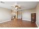 Open living room area with wood flooring and staircase access to upper level at 7800 Four Seasons Dr, Las Vegas, NV 89129