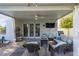 Inviting covered patio featuring comfortable seating, a ceiling fan, and a wall-mounted television at 7800 Four Seasons Dr, Las Vegas, NV 89129