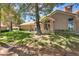 Well-kept home exterior with lush lawn and mature trees, creating a serene and inviting atmosphere at 8541 Heather Downs Dr, Las Vegas, NV 89113