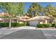 Charming home featuring a spacious two-car garage, neat landscaping, and a well-maintained yard at 8541 Heather Downs Dr, Las Vegas, NV 89113