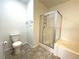 This bathroom features a shower, a bathtub, and decorative tile flooring at 855 N Stephanie St # 112, Henderson, NV 89014