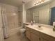 Bright bathroom featuring a bathtub, a shower, and a single vanity at 855 N Stephanie St # 112, Henderson, NV 89014