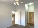Bedroom has carpet, a ceiling fan and is open to the kitchen and bathroom at 855 N Stephanie St # 112, Henderson, NV 89014