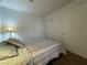 Cozy bedroom with a bed, a lamp, and sliding closet doors at 855 N Stephanie St # 112, Henderson, NV 89014