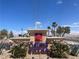 Landscaped community sign for Galleria Villas with a bright blue sky at 855 N Stephanie St # 112, Henderson, NV 89014