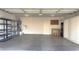 Spacious two-car garage with shelving and built-in cabinets at 855 N Stephanie St # 112, Henderson, NV 89014