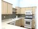 Kitchen featuring bright lighting, stainless steel appliances and light-colored cabinetry at 855 N Stephanie St # 112, Henderson, NV 89014