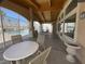 Covered poolside area with tables and seating perfect for relaxing at 855 N Stephanie St # 112, Henderson, NV 89014