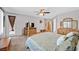 Light-filled primary bedroom features a cozy bed, ceiling fan and serene decor at 8828 Monte Oro Dr, Las Vegas, NV 89131