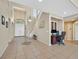 Open foyer with a staircase, tile flooring, and a view of the front door at 8828 Monte Oro Dr, Las Vegas, NV 89131