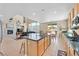 Well-lit kitchen with stainless appliances, granite countertops and open access to the living area at 8828 Monte Oro Dr, Las Vegas, NV 89131