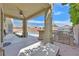 Inviting covered patio with an outdoor kitchen, BBQ, and a view of the pool at 8828 Monte Oro Dr, Las Vegas, NV 89131